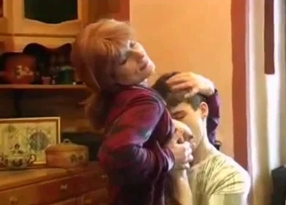 Young son is playing with his mom's tits